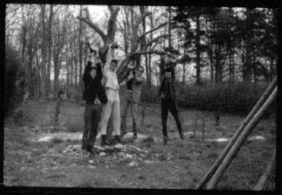 grainy black and white print of the band posing like The Monkees