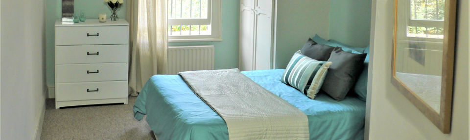 green, cyan and grey bedroom